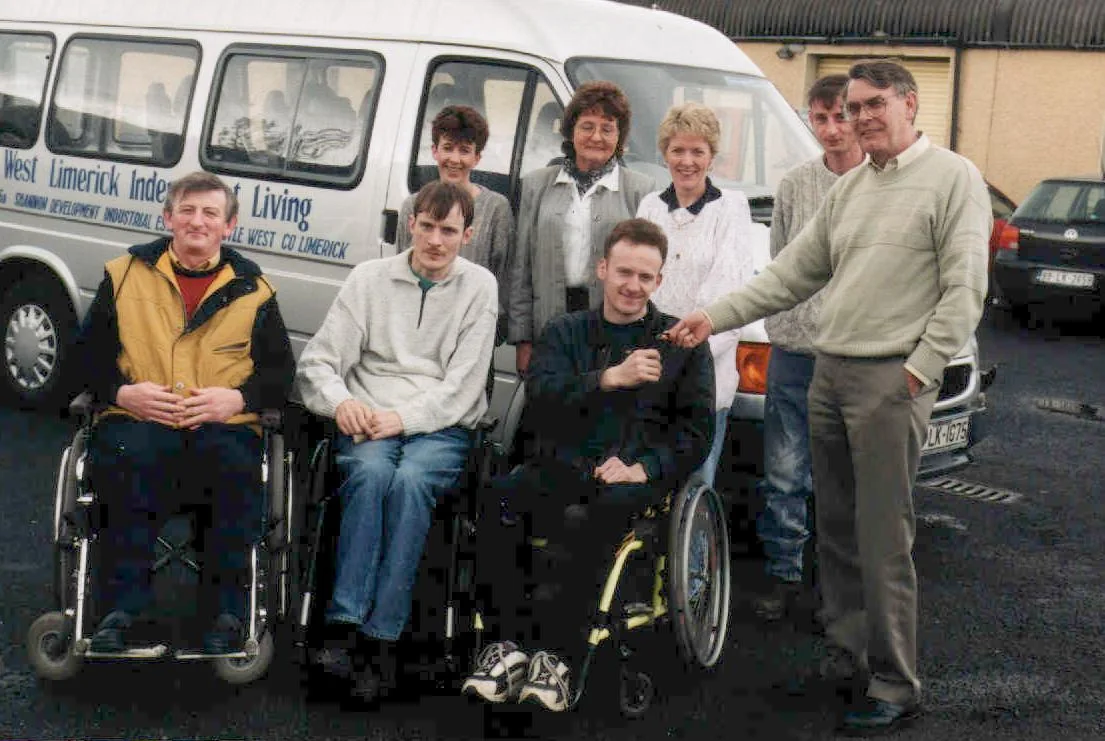 WLIL board and staff receiving keys to an early wheelchair-accessible vehicle around 1999