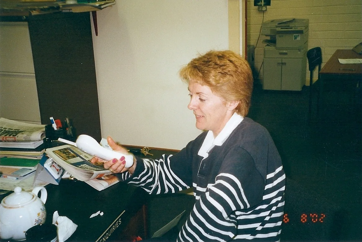 Anne Shine, founder and Board member, making a phone call in 2000